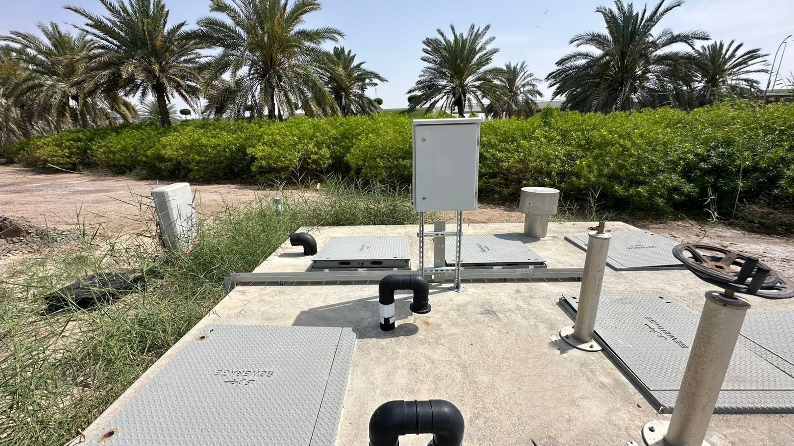 Sewage lifting station with palm trees